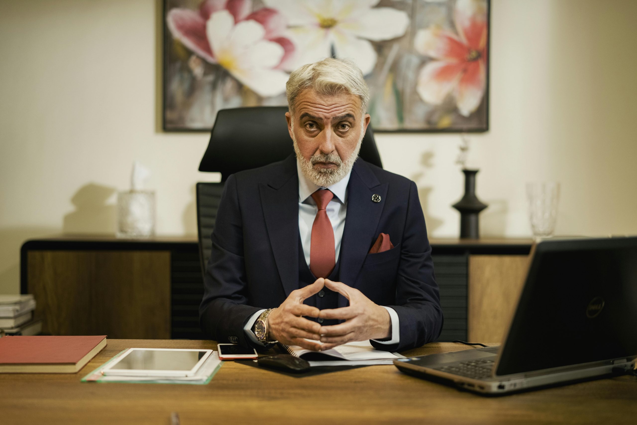 A stern CEO looking across the table