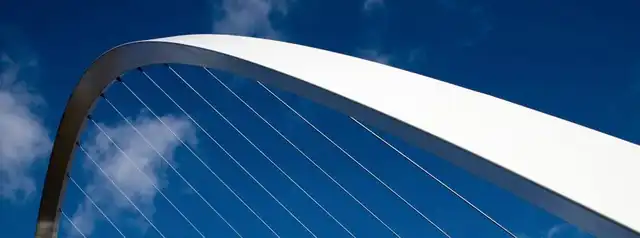 Arched bridge against a blue sky