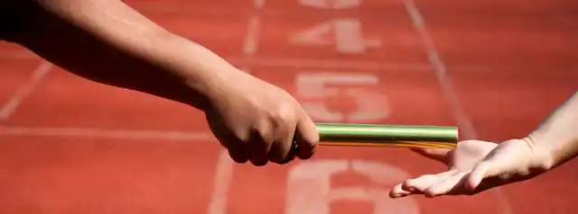 Relay baton passing between runners